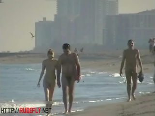 Peeping at a marvellous nudist couple on the beach